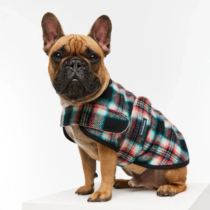 A red Hamish McBeth dog jumper with an embroidered sleeping dog and bone